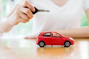small car and key for car, car leasing and car loan concept photo
