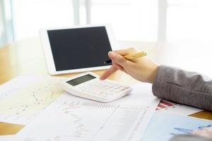 woman hand with pen and business report photo