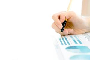 Businesswoman holding a pen and analyze data photo