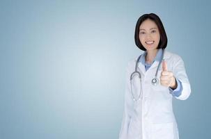 Doctor woman on blue background photo