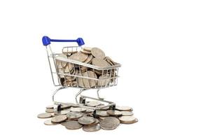 coins in shopping cart on the white background photo