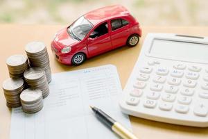 money, pile coin with account book and car, concept photo