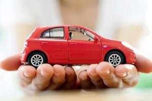 Hand with car. Auto dealership and rental concept background. photo