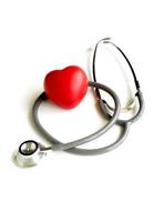 A heart with a stethoscope, isolated on white background photo