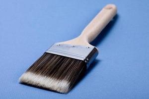 Brush on blue background photo