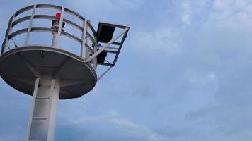 Low angle view of the lighthouse at dusk against the sky background,copy space. photo