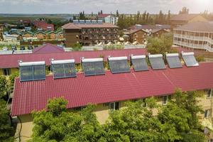 solar water heaters on the roof of the hotel photo