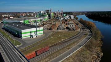 pipes of woodworking enterprise plant sawmill near river. Air pollution concept. Industrial landscape environmental pollution waste of thermal power plant photo