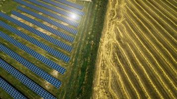 Aerial shot top view of solar panel photovoltaic farm photo