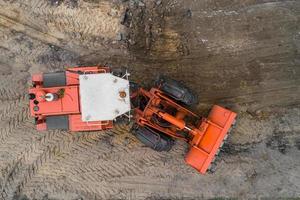 Grader repairs the road top view photo