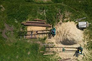 production of logs for wooden houses top view photo