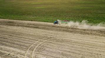 Tractor in a farmer field top view photo
