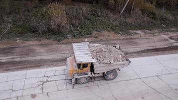 the truck transports the minerals from the top view from the drone photo
