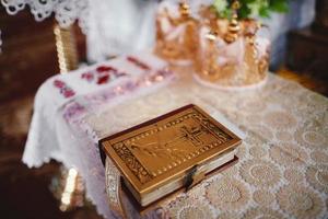 Bible on altar table. Faith and religion concept. Preaching background. Church interior. Lord's table concept. Holy holidays and Christmas concept. Christianity tradition. photo