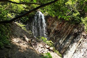 waterfall. mountain waterfall in park photo