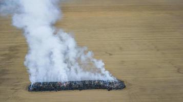 fire in the field top view from the drone photo