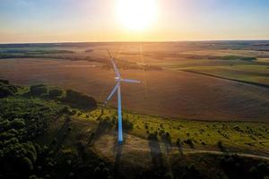wind generator on the background of the setting sun top view from a drone photo