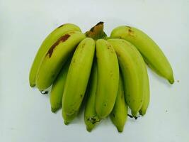 Photo of green bananas nearing ripening