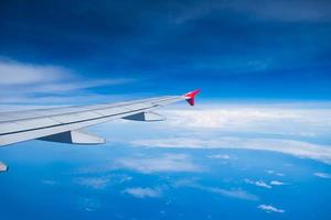 View airplane cloudy in sky photo