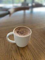 Hot chocolate cup on wooden table