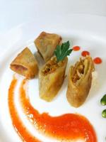 Lumpia is a typical Central Javanese Indonesian snack consisting of a mixture of young bamboo shoots, eggs, fresh vegetables, and meat or seafood, in a roll made of thin sheets of wheat flour