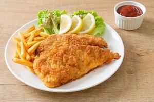 Homemade Breaded Weiner Schnitzel with Potato Chips photo