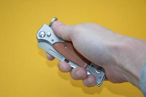 Knife as a cold piercing and cutting weapon for self-defense photo