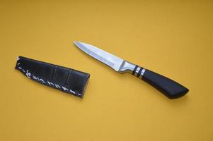 Knife as a cold piercing and cutting weapon for self-defense photo