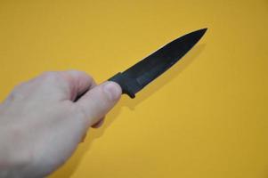 Knife as a cold piercing and cutting weapon for self-defense photo