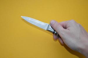 Knife as a cold piercing and cutting weapon for self-defense photo