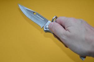 Knife as a cold piercing and cutting weapon for self-defense photo