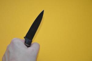 Knife as a cold piercing and cutting weapon for self-defense photo