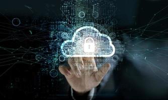 businessman touching Cloud with Padlock icon on network connection, digital background. Cloud computing and network security concept photo