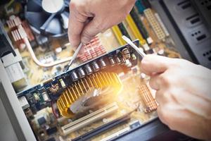 hands with tools for repair computer photo