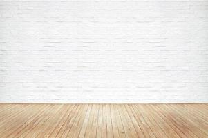 Vintage old brown wooden floor texture with white brick wall dust grime for background photo