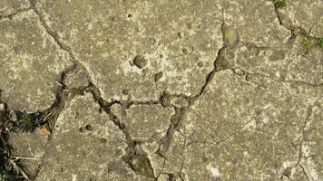 old cracked concrete. Grunge concrete cement wall with crack, for your design and background texture. stone walkway. concrete texture photo