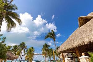 Serene turquoise Isla Mujeres beach Playa Norte famous for emerald waters, sandy sea shore and beach bars for fun and beach parties photo