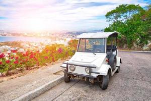 Pulmonia taxi with panoramic view of the Mazatlan Old City in the background, Mexico photo