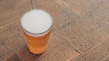 Glass of light beer on wood table.,3d model and illustration. photo