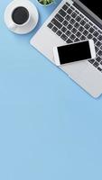 Business concept, relaxation in working time, drinking coffee taking a break on clean light blue office table, copy space, flat lay, top view, mockup photo
