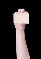 Young asia clean girl hand holding a blank kraft brown paper card template isolated on black background, clipping path, close up, mock up, cut out photo