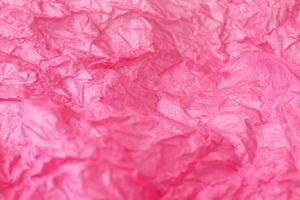 Pink wrinkled paper background photo