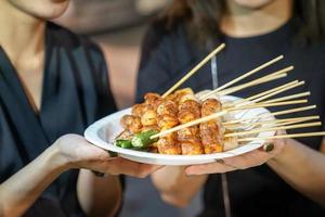 Spicy Mala Chinese spices Barbecue pork thai style, Foodtruck, Bangkok, Thailand. photo