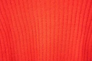 Close up beautiful red craft sweater texture in Thailand. photo