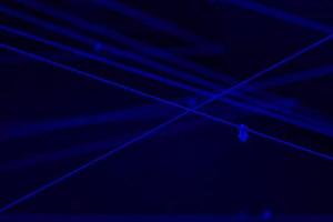 white rope cross in the dark black light room for background with text space. photo
