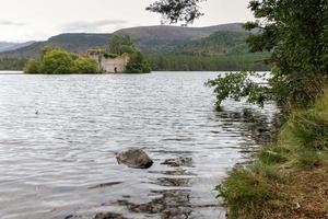 Castle in the middle of Loch an Eilein near Aviemore Scotland photo