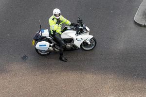 LONDON, UK, 2014. Metropoliatan Police traffic officer clearing the way for a VIP