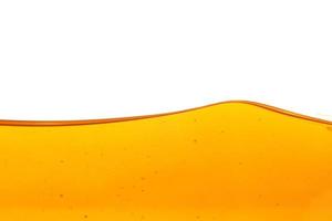 Wave of oil viscosity and air bubbles inside oil isolated on white background. photo