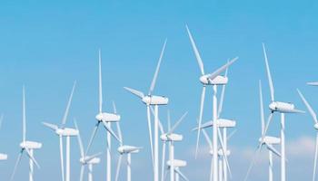 close up of wind turbines with clear sky photo