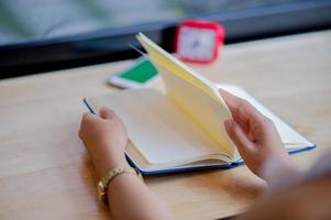 Hands and books that are laid bare with space In the morning room Book reading concept photo